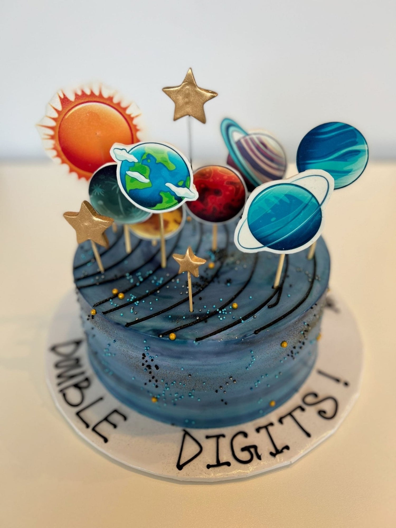 Solar system edible print on whipped cream - custom cake
