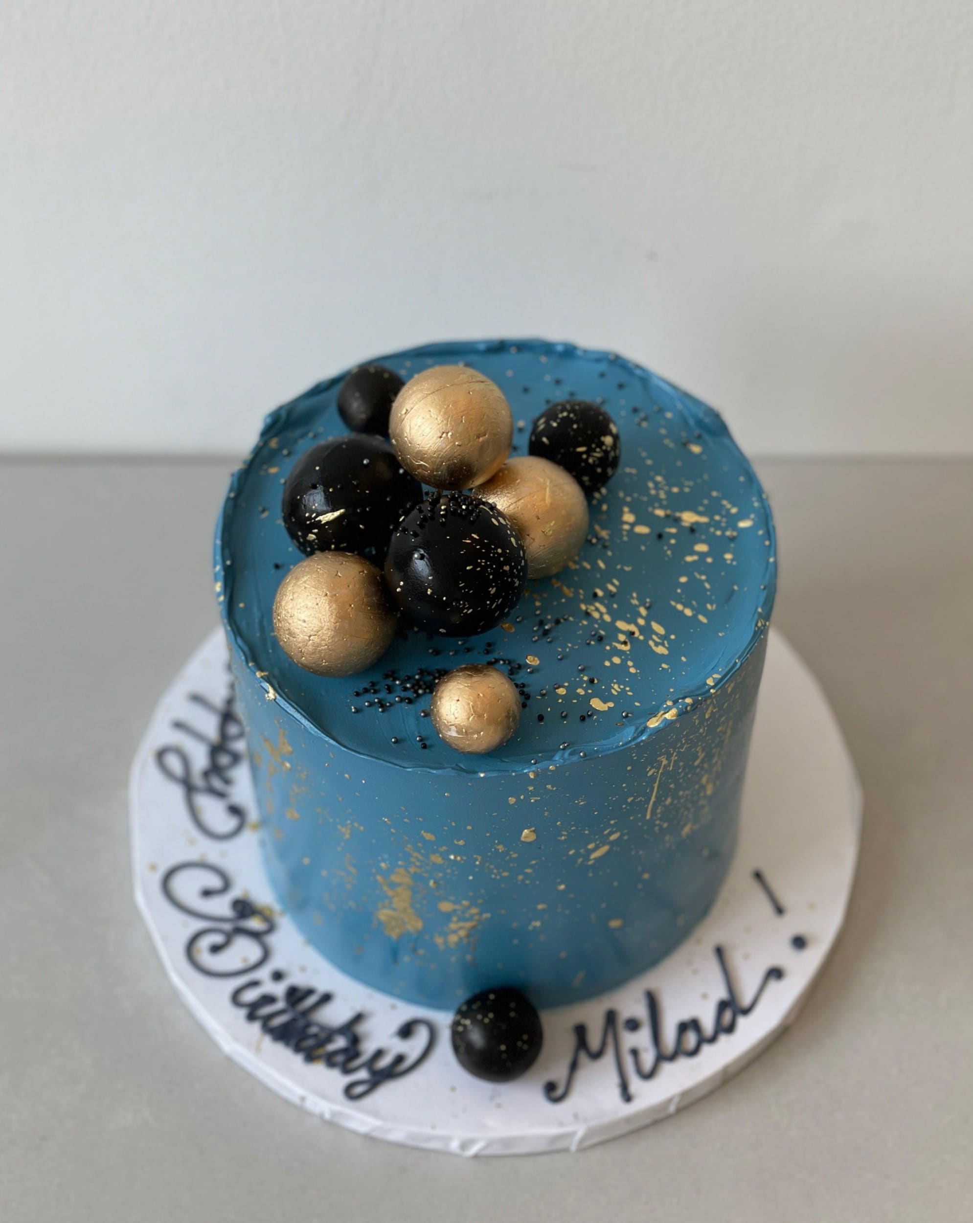 Splashed &amp; textured spheres on buttercream - custom cake