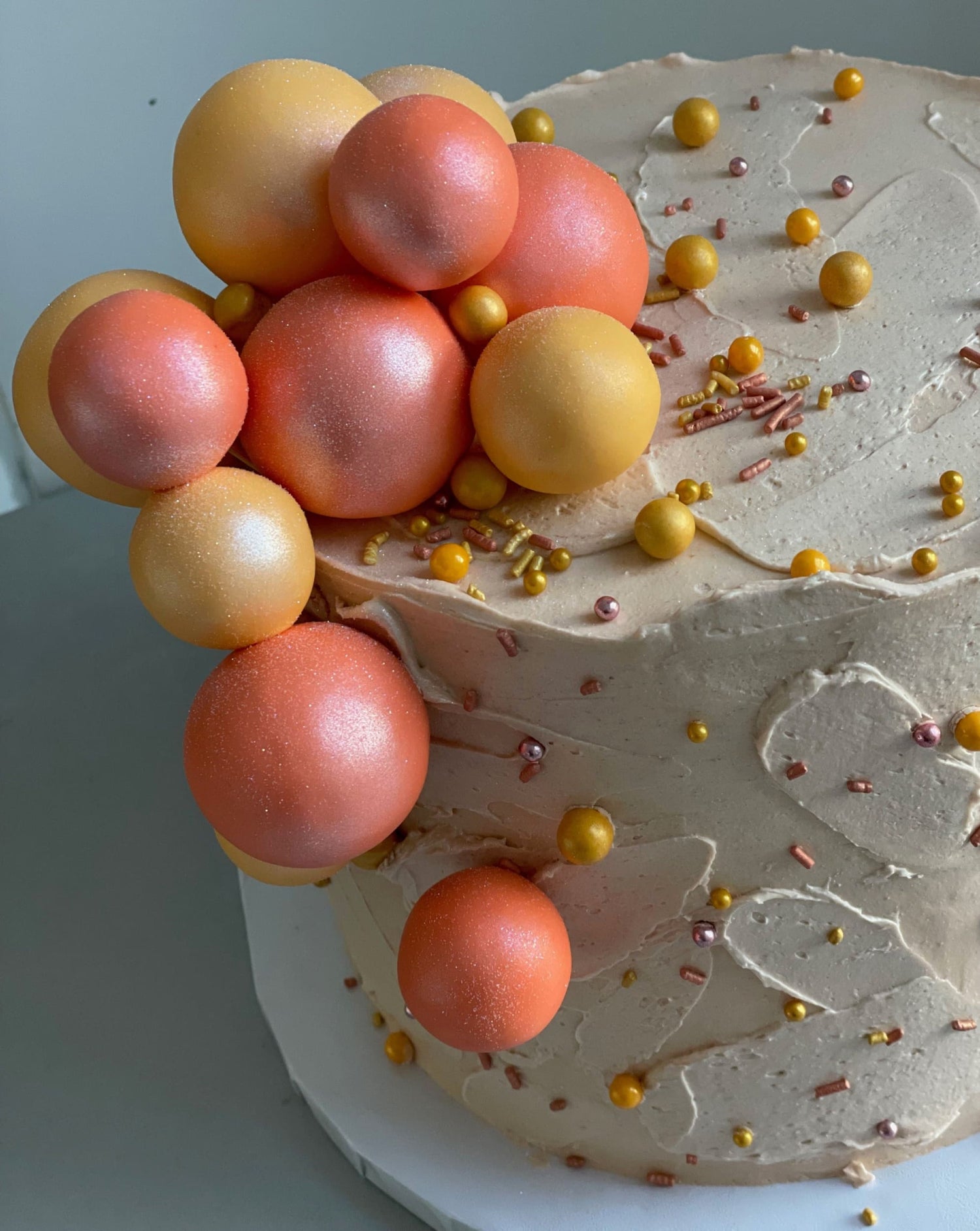 Splashed &amp; textured spheres on buttercream - custom cake