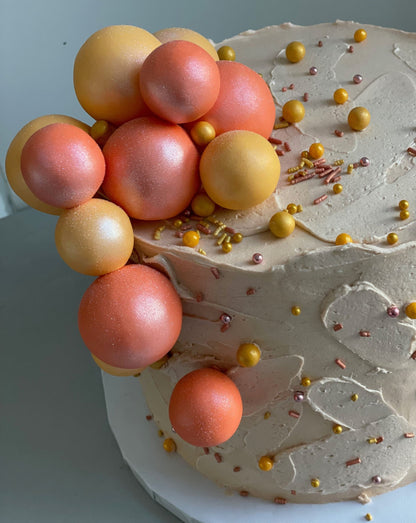 Splashed &amp; textured spheres on buttercream - custom cake