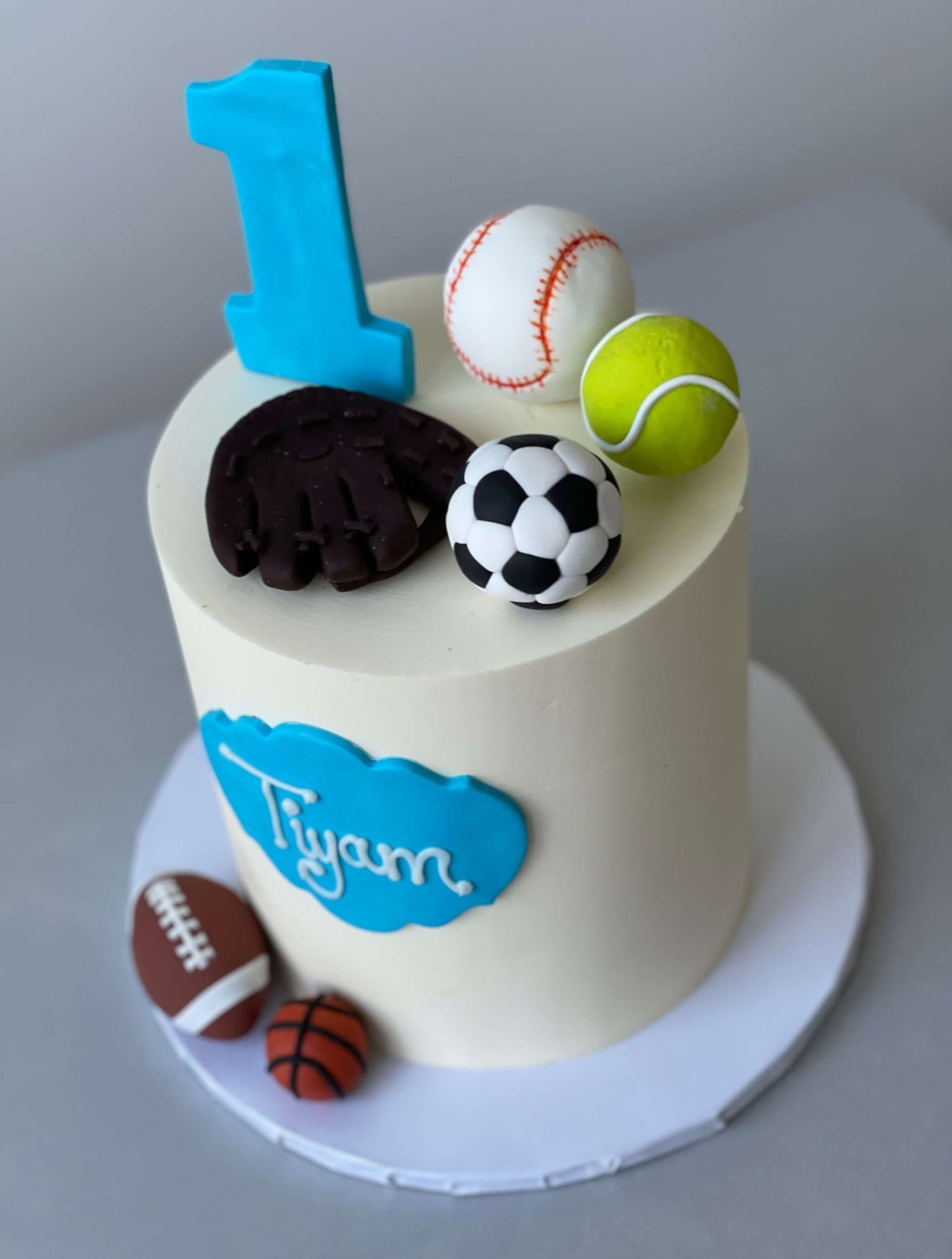 Sports balls on buttercream - custom cake