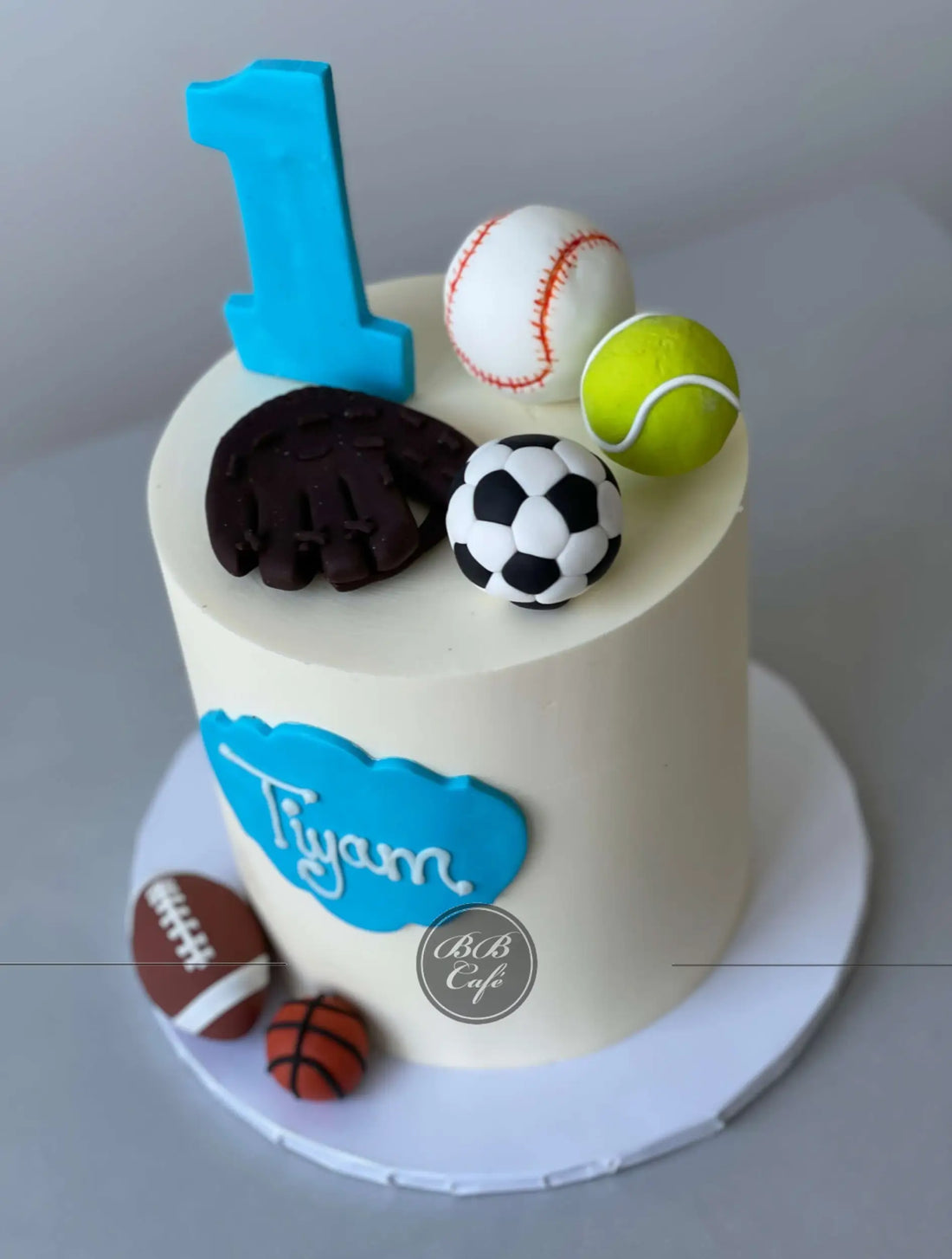 Sports balls on buttercream - custom cake