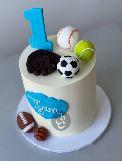 Sports balls on buttercream - custom cake