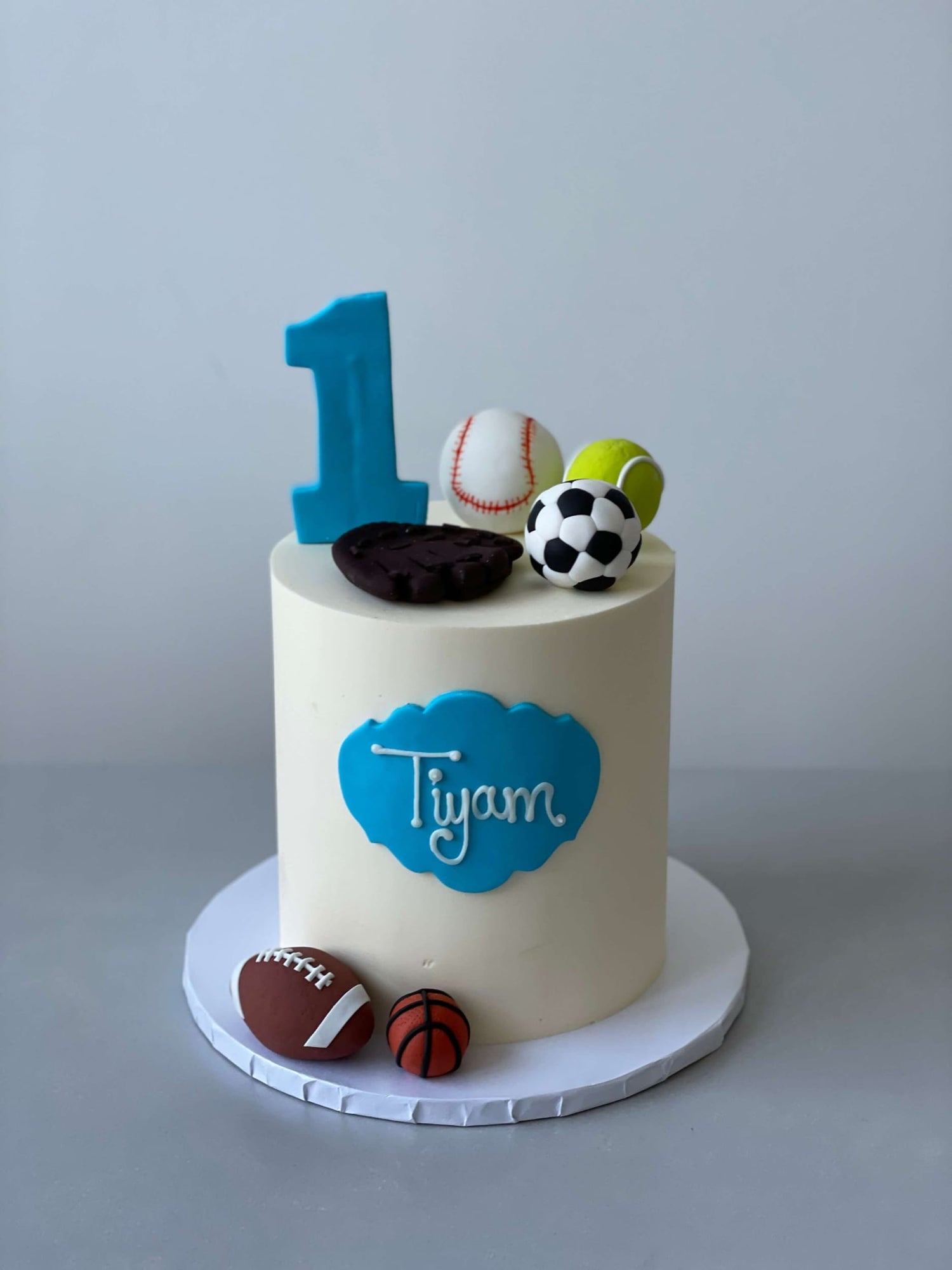 Sports balls on buttercream - custom cake
