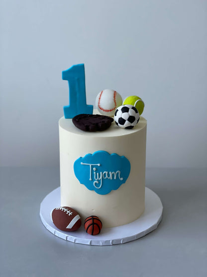 Sports balls on buttercream - custom cake