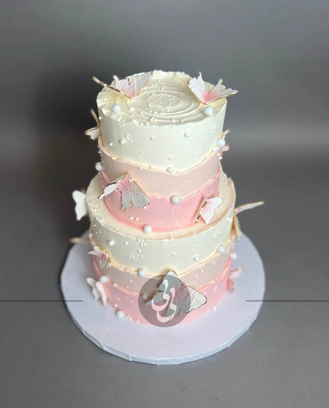Sugar butterflies on layered buttercream - custom cake