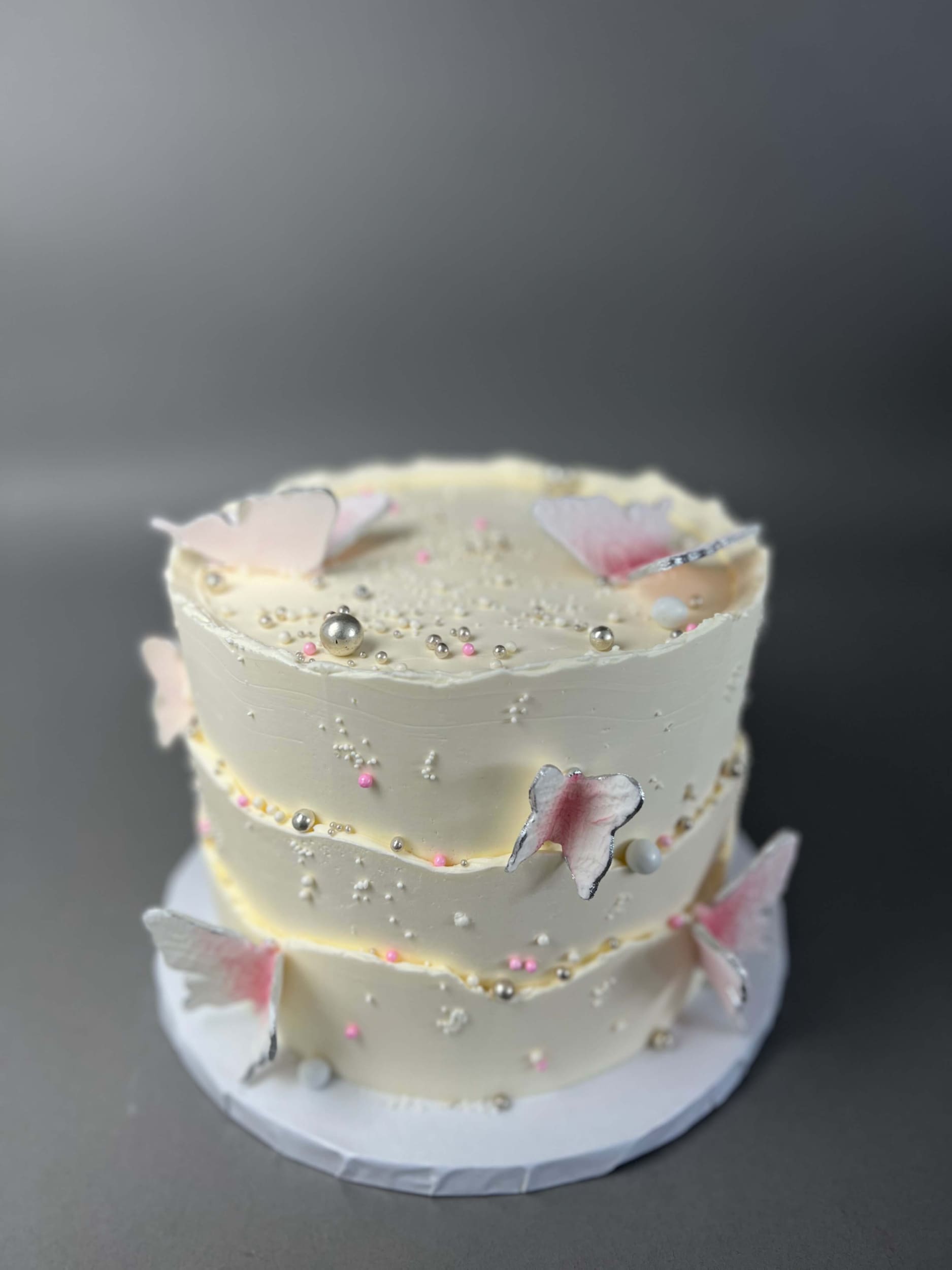 Sugar butterflies on layered buttercream - custom cake