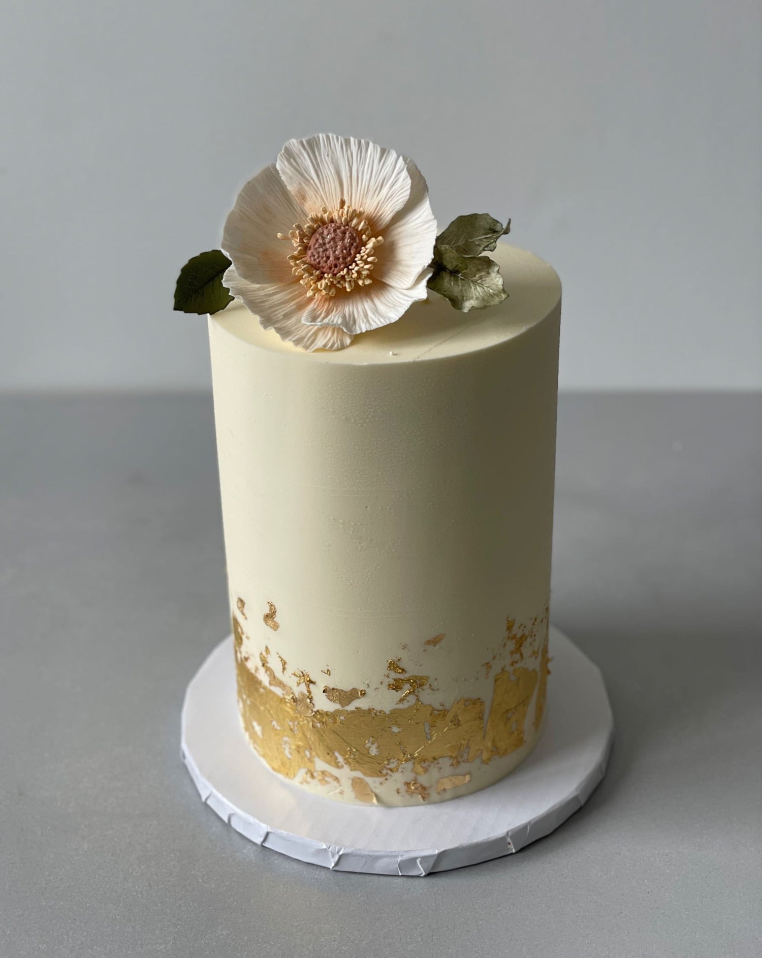 Sugar flower &amp; gold foil on buttercream - custom cake