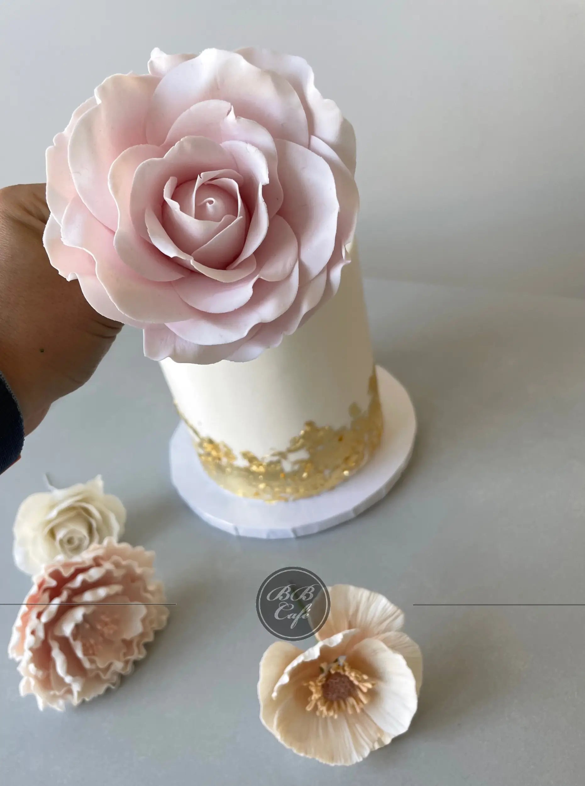 Sugar flower &amp; gold foil on buttercream - custom cake