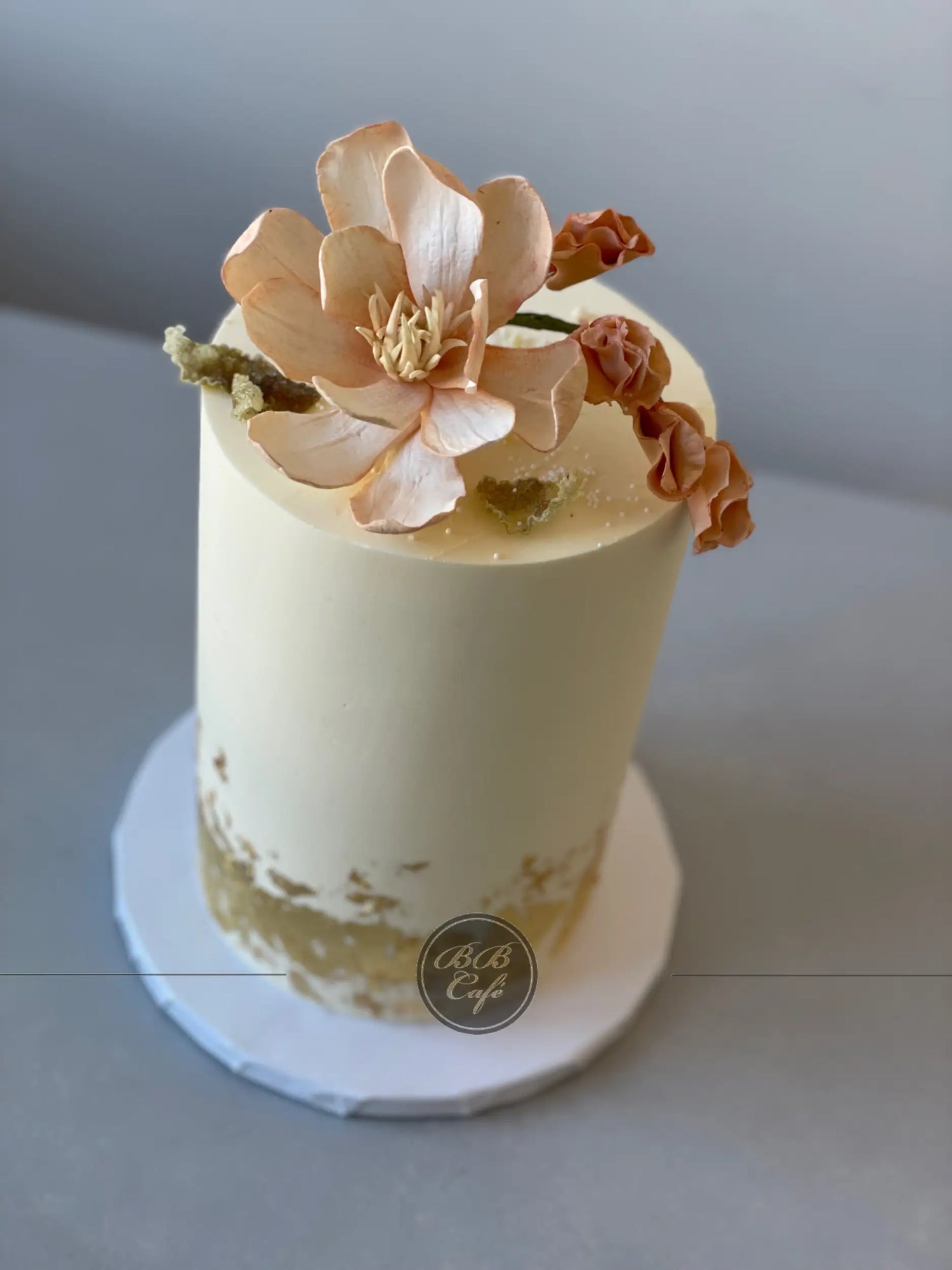 Sugar flower &amp; gold foil on buttercream - custom cake