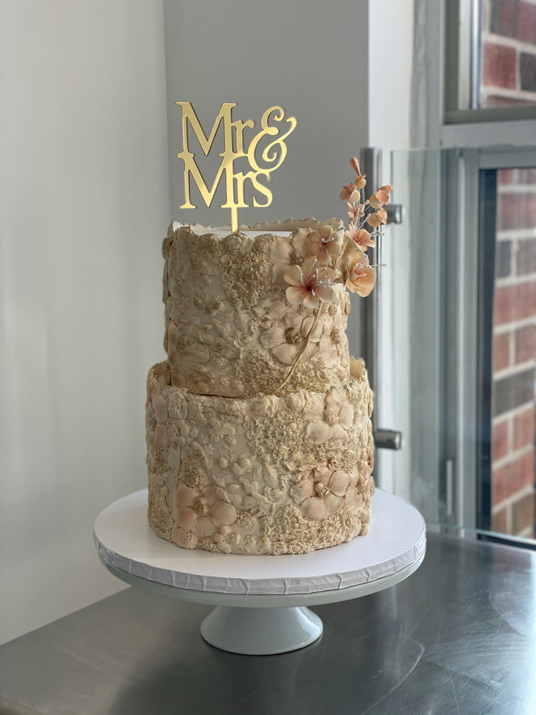 Sugar flower on floral imprinted fondant - custom cake