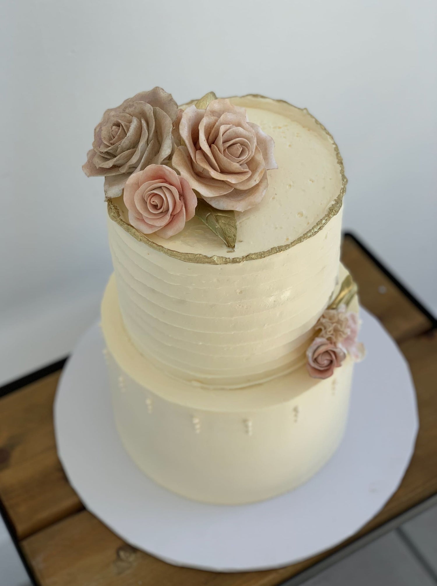 Sugar flowers on golden deckled edge buttercream - custom cake