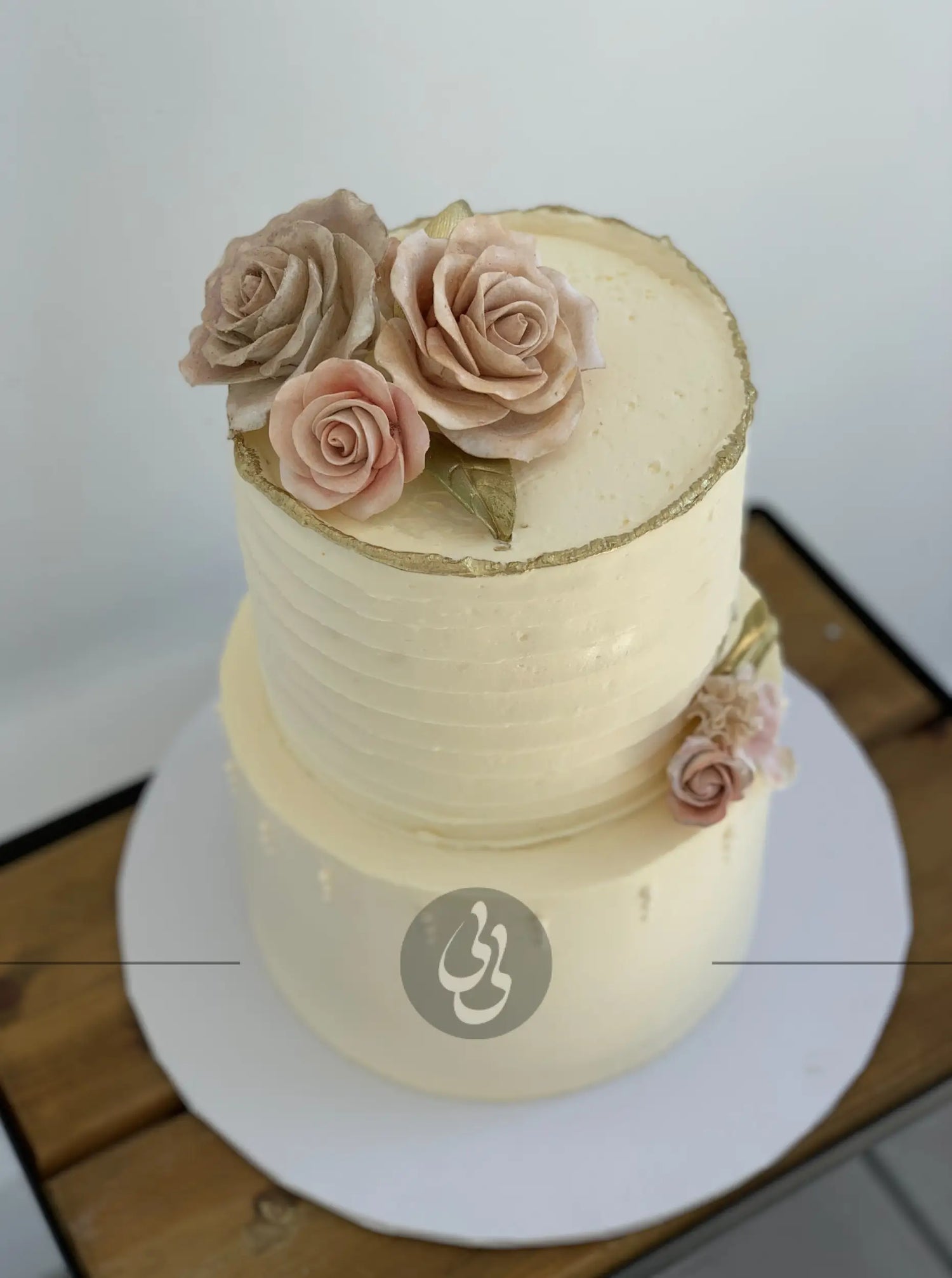 Sugar flowers on golden deckled edge buttercream - custom cake