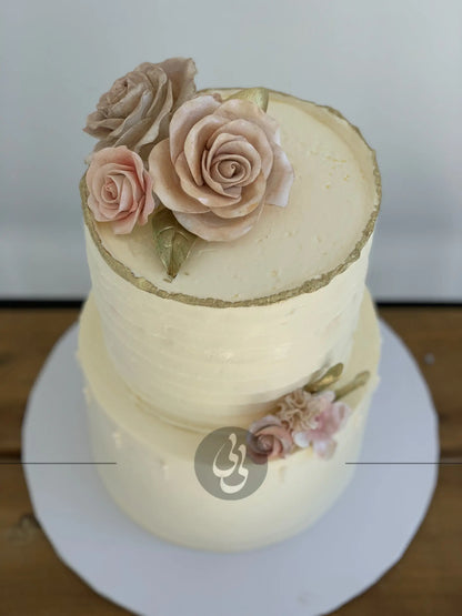 Sugar flowers on golden deckled edge buttercream - custom cake