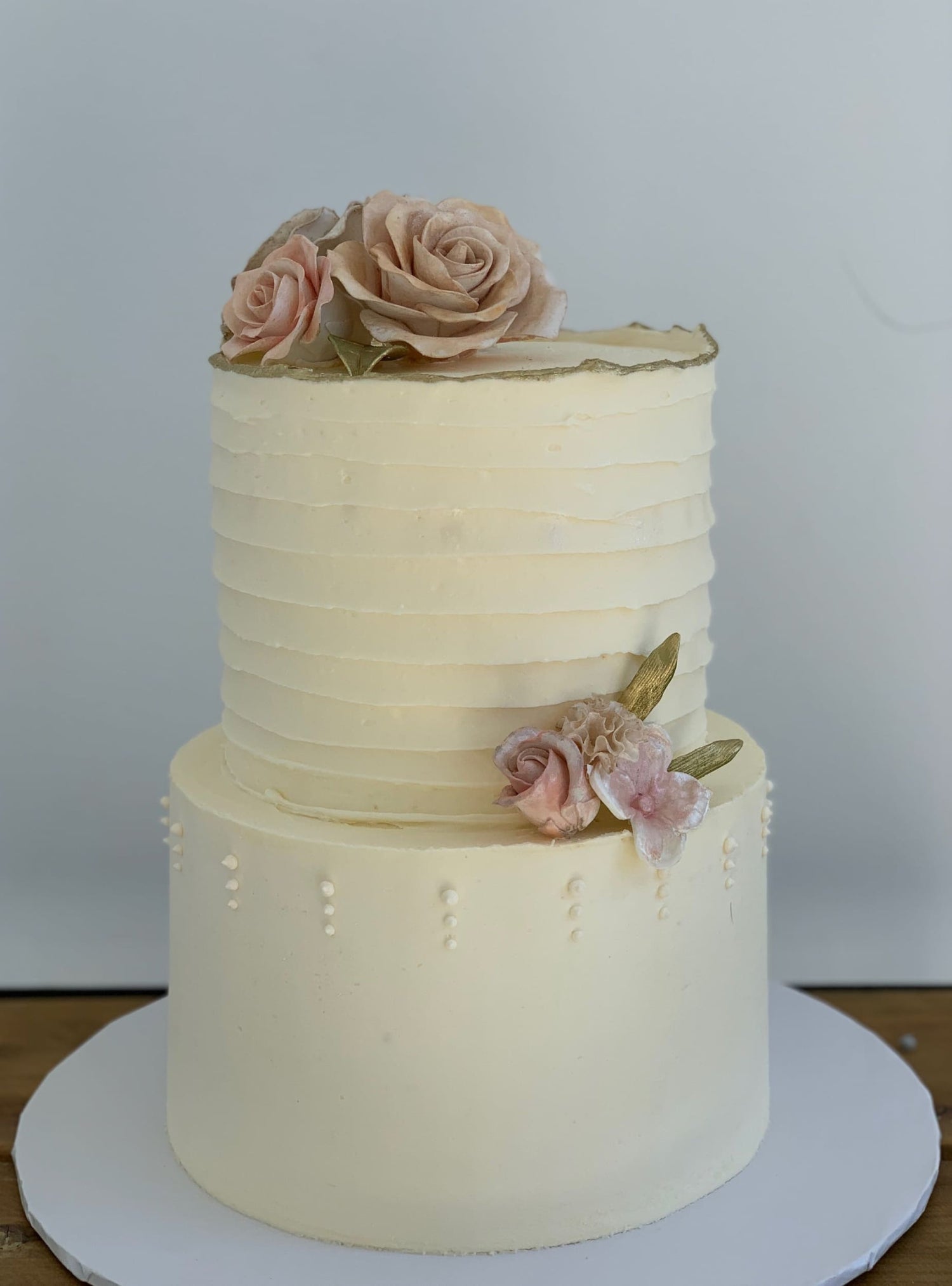 Sugar flowers on golden deckled edge buttercream - custom cake