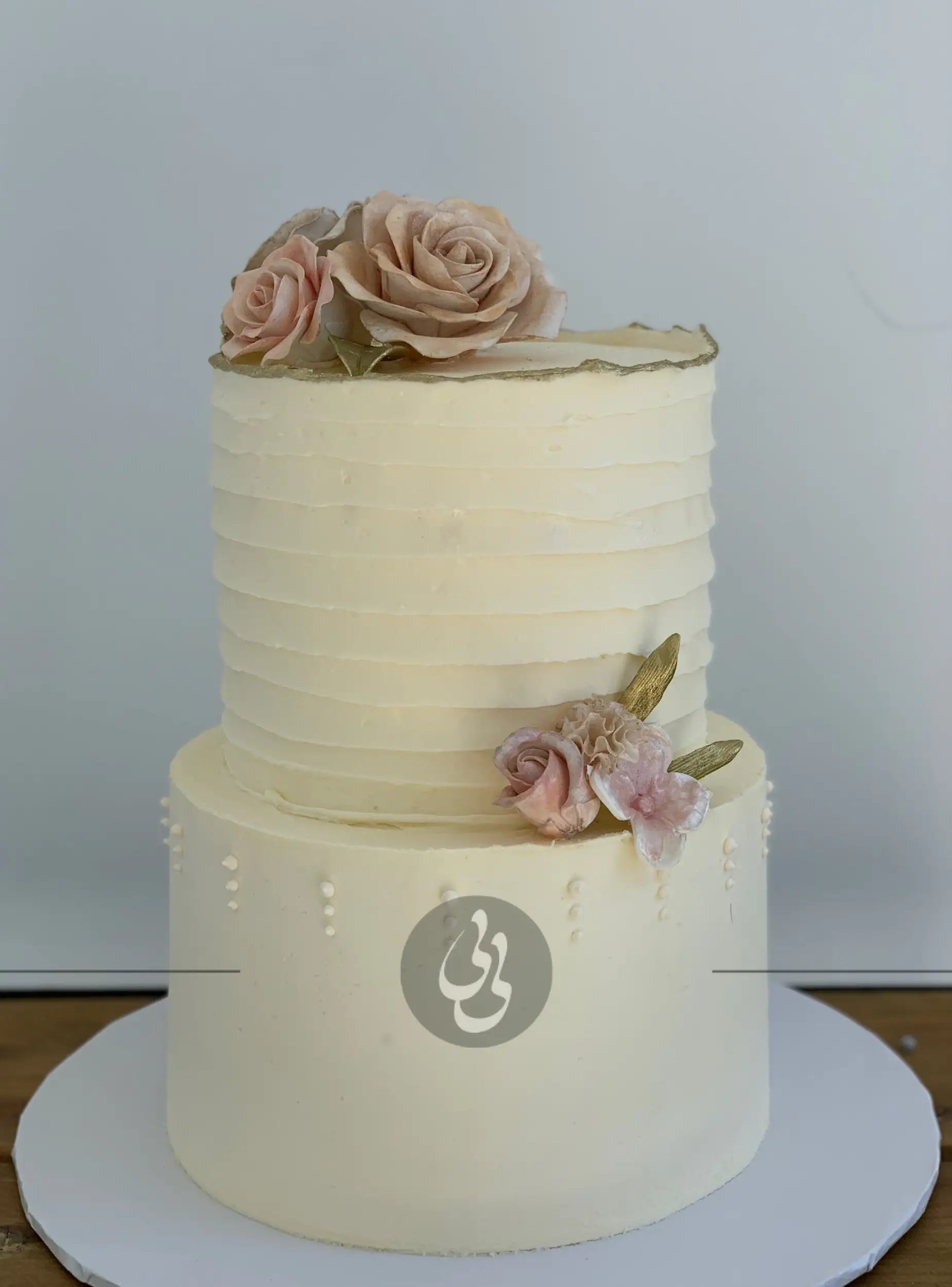 Sugar flowers on golden deckled edge buttercream - custom cake