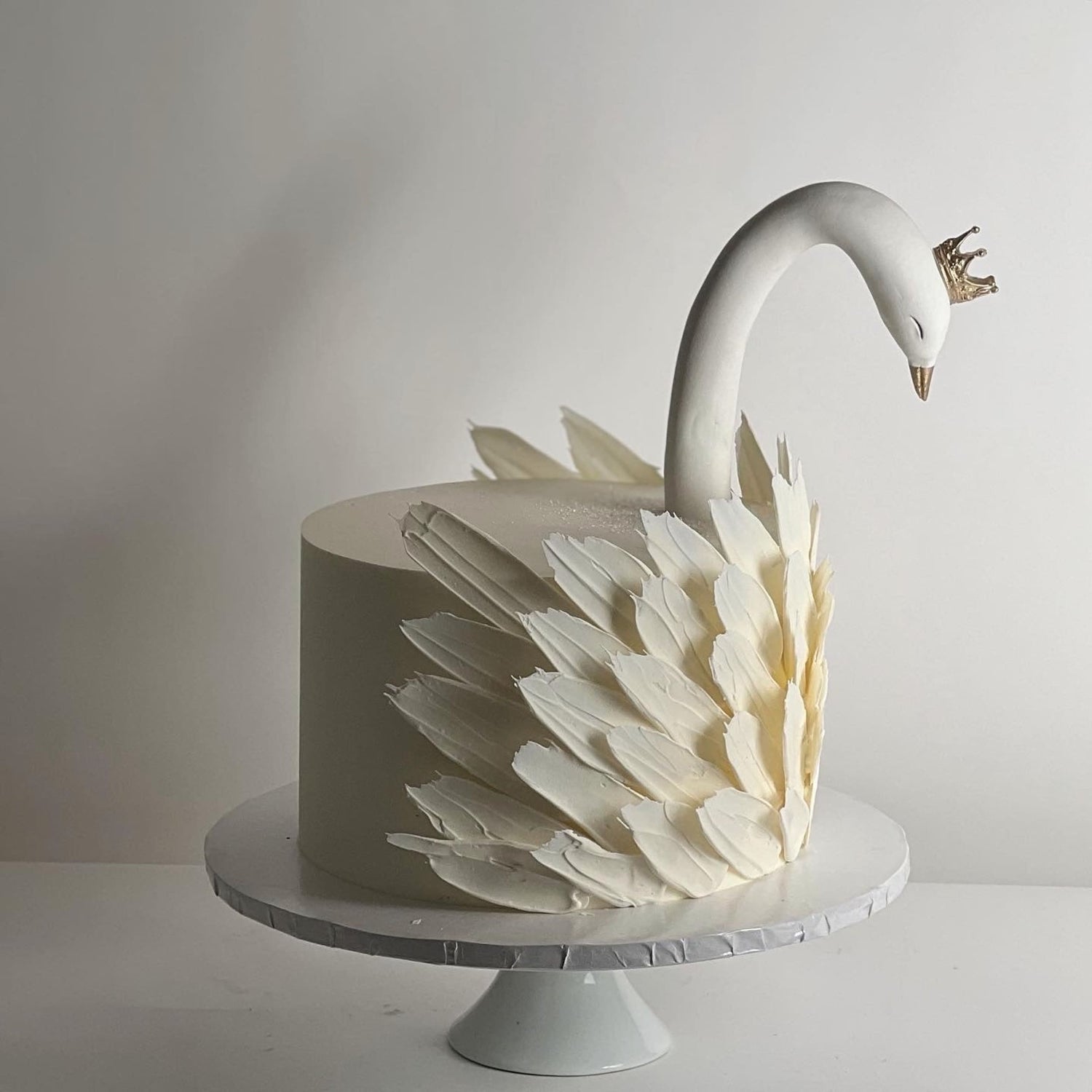 Swan &amp; chocolate feathers on buttercream - custom cake