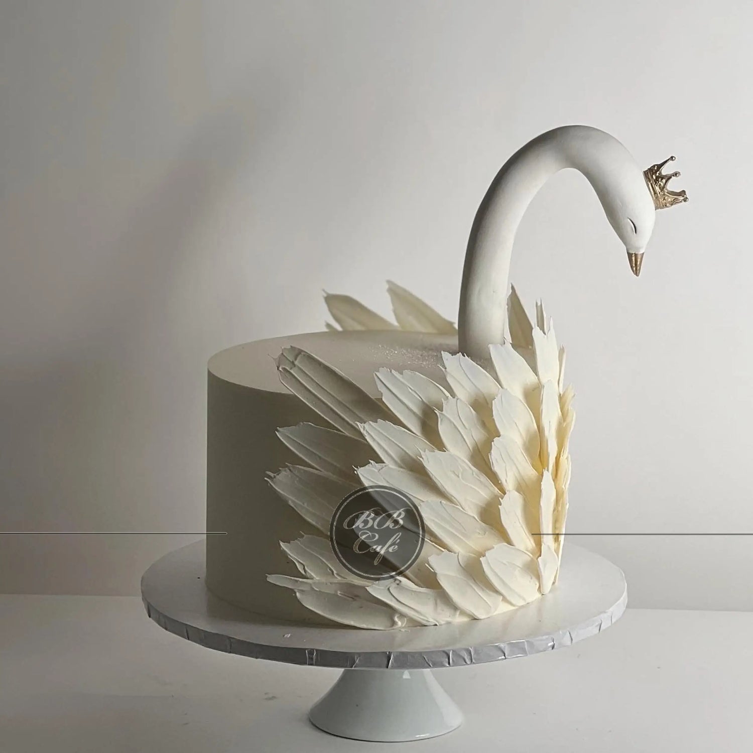 Swan &amp; chocolate feathers on buttercream - custom cake