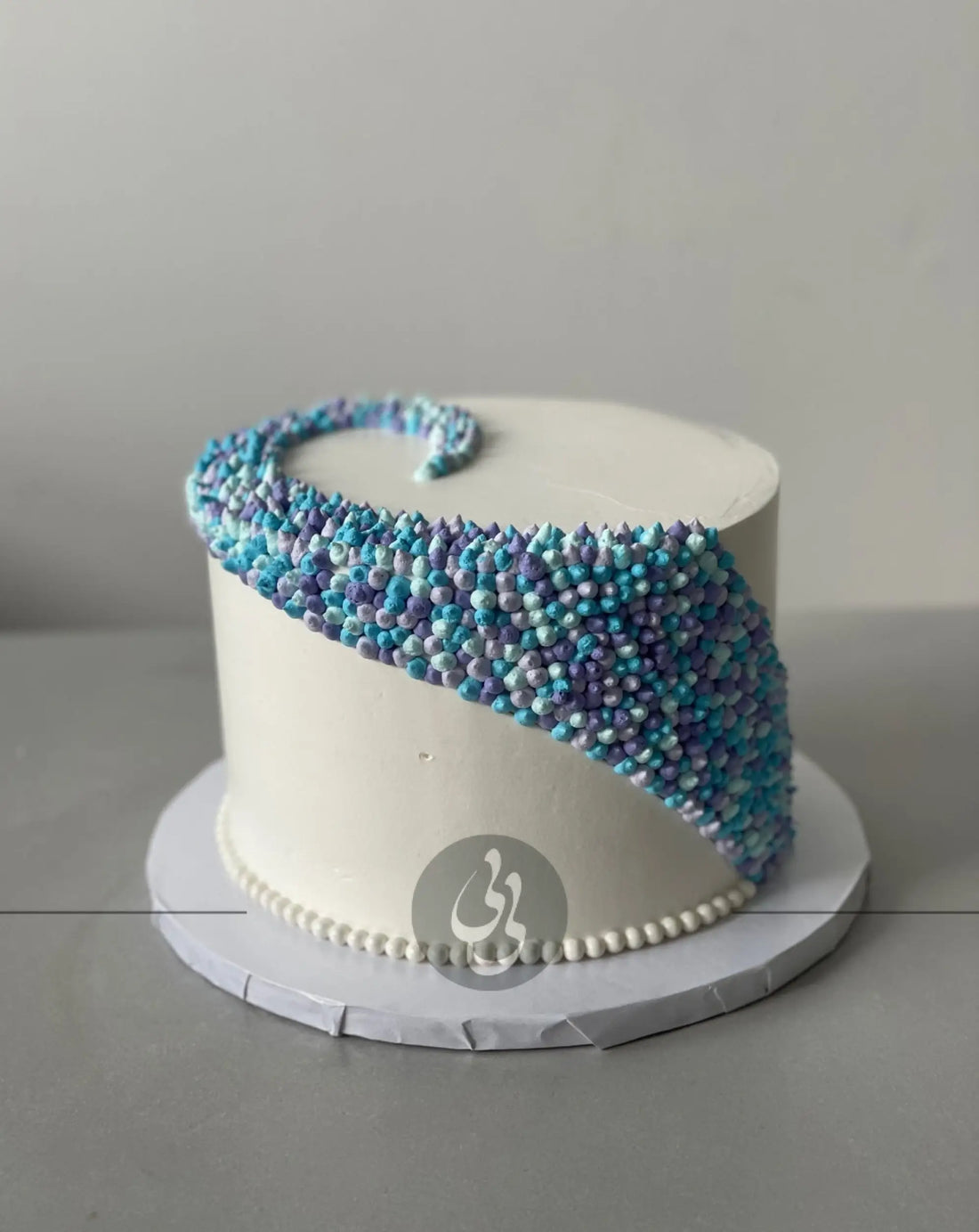 Swirl dots in whipped cream - custom cake