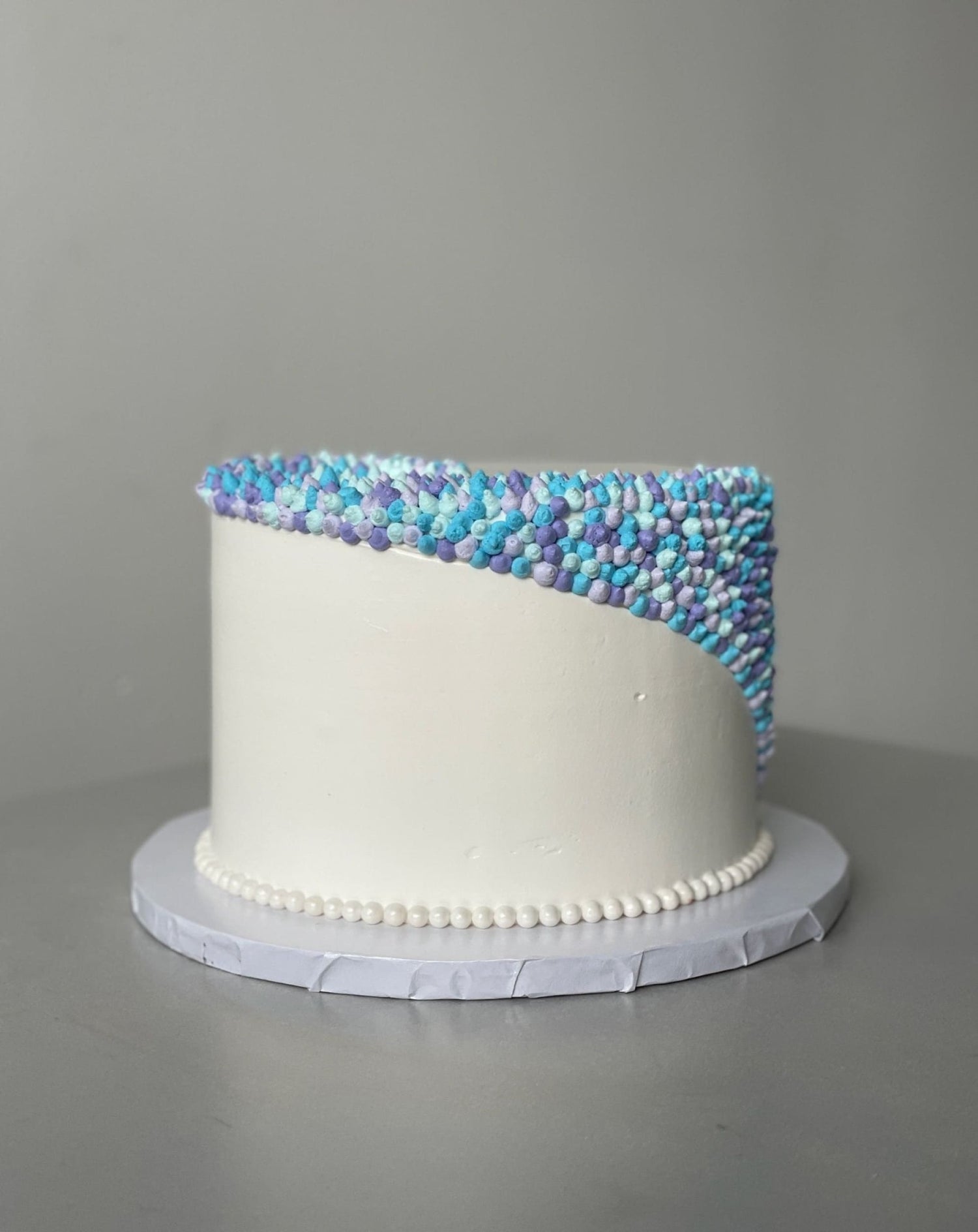 Swirl dots in whipped cream - custom cake