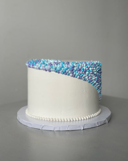 Swirl dots in whipped cream - custom cake