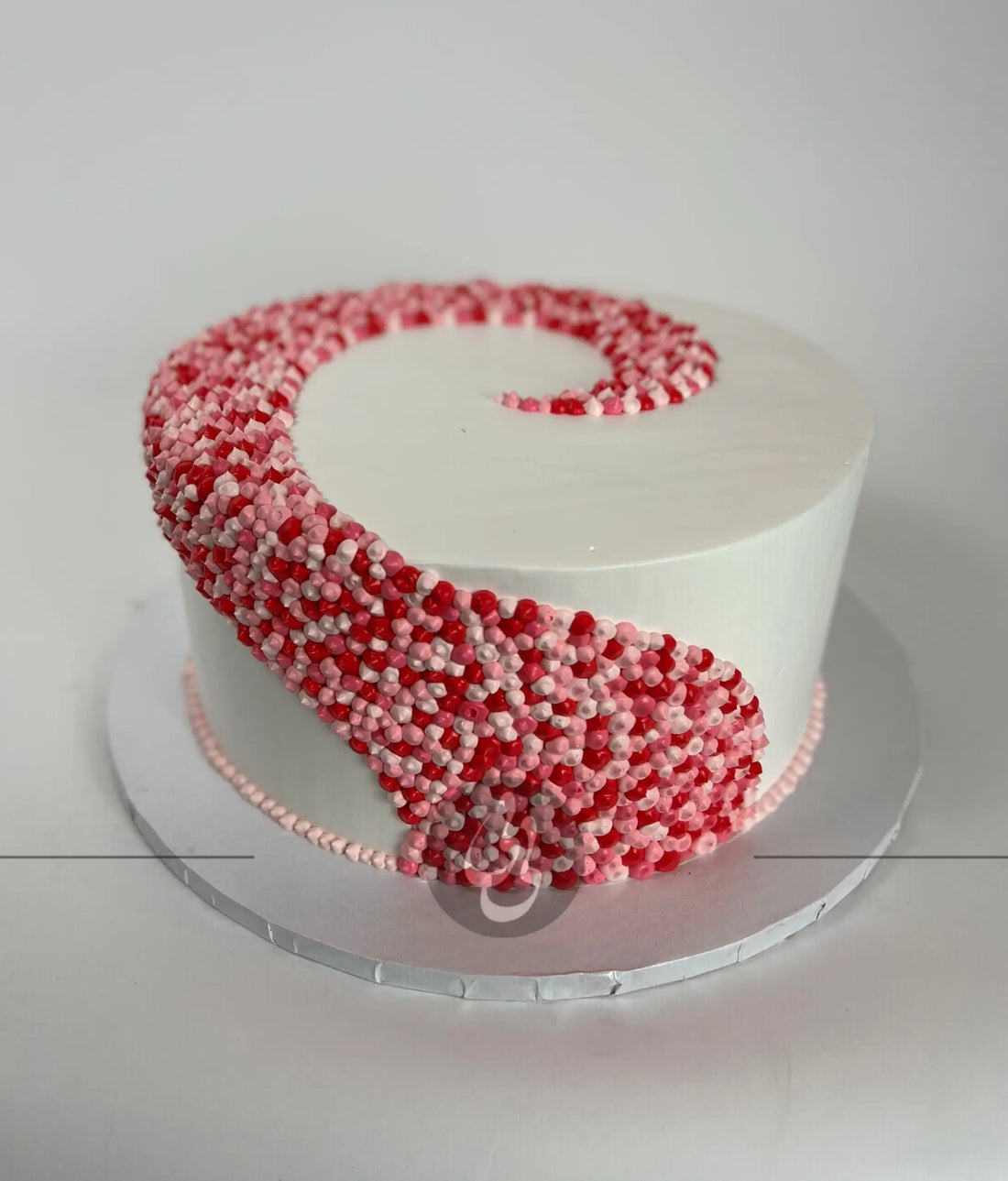 Swirl dots in whipped cream - custom cake