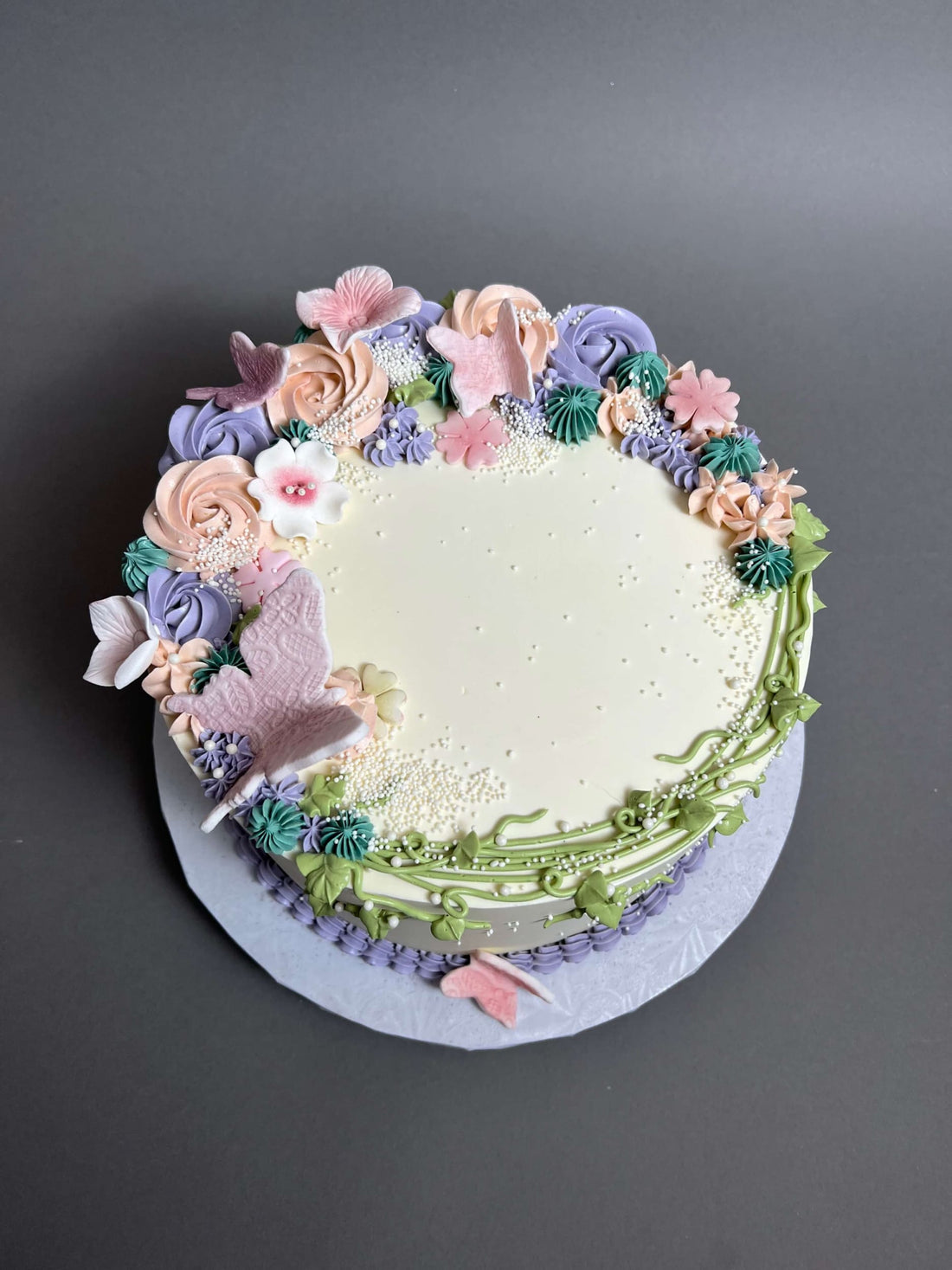Vines and rosette butterfly on buttercream - custom cake