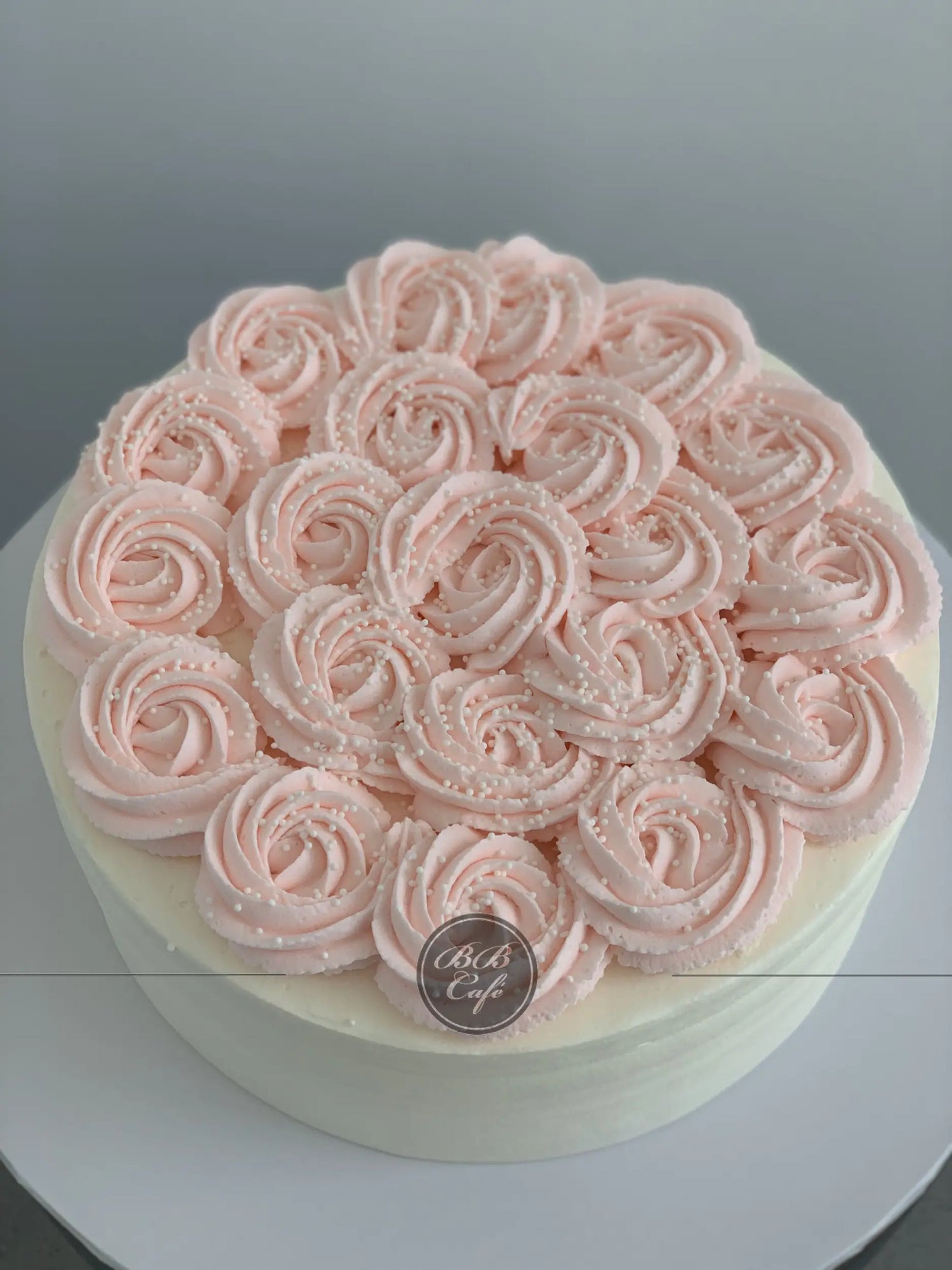 Whipped cream rosettes on top - custom cake