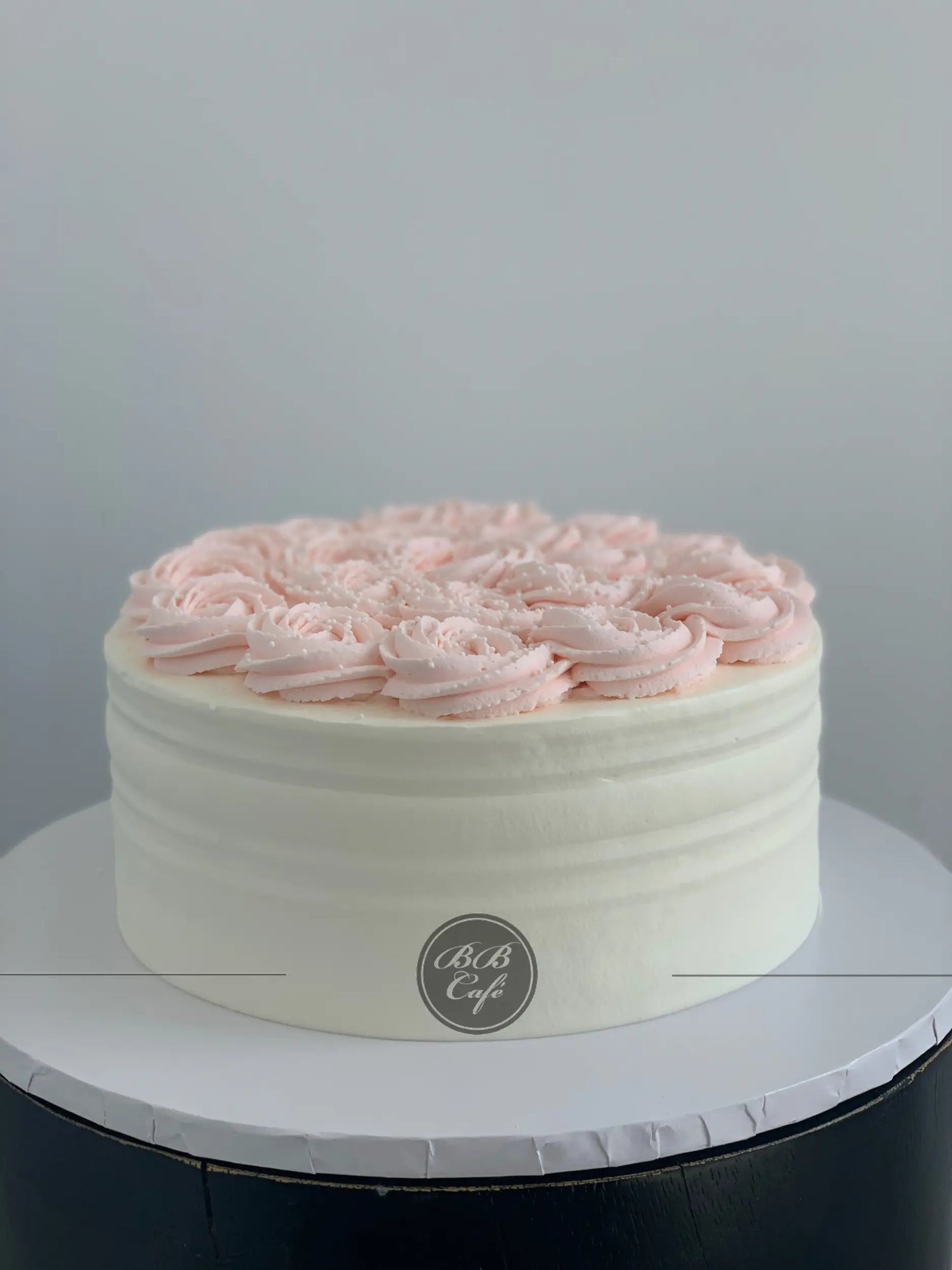 Whipped cream rosettes on top - custom cake