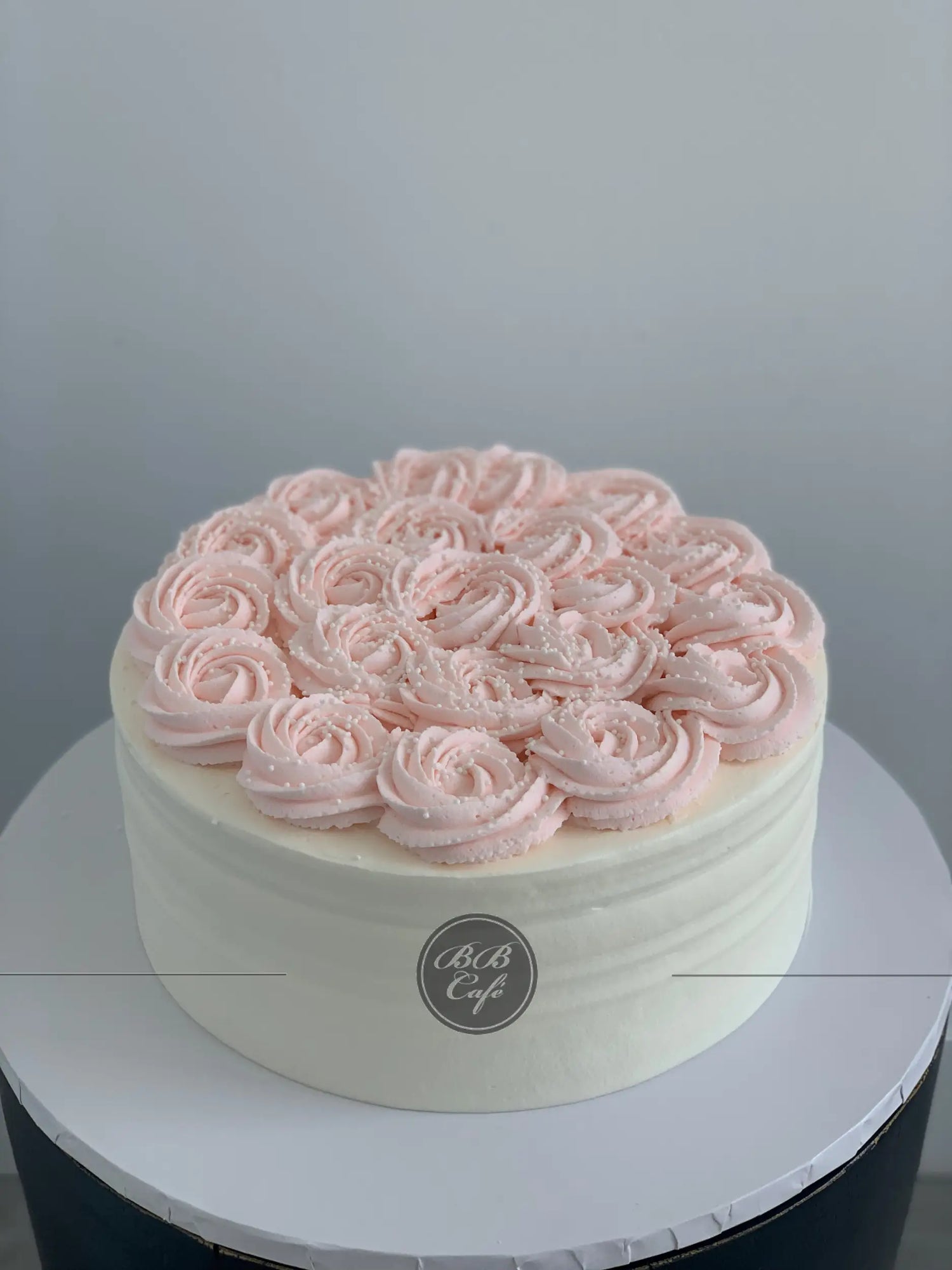 Whipped cream rosettes on top - custom cake