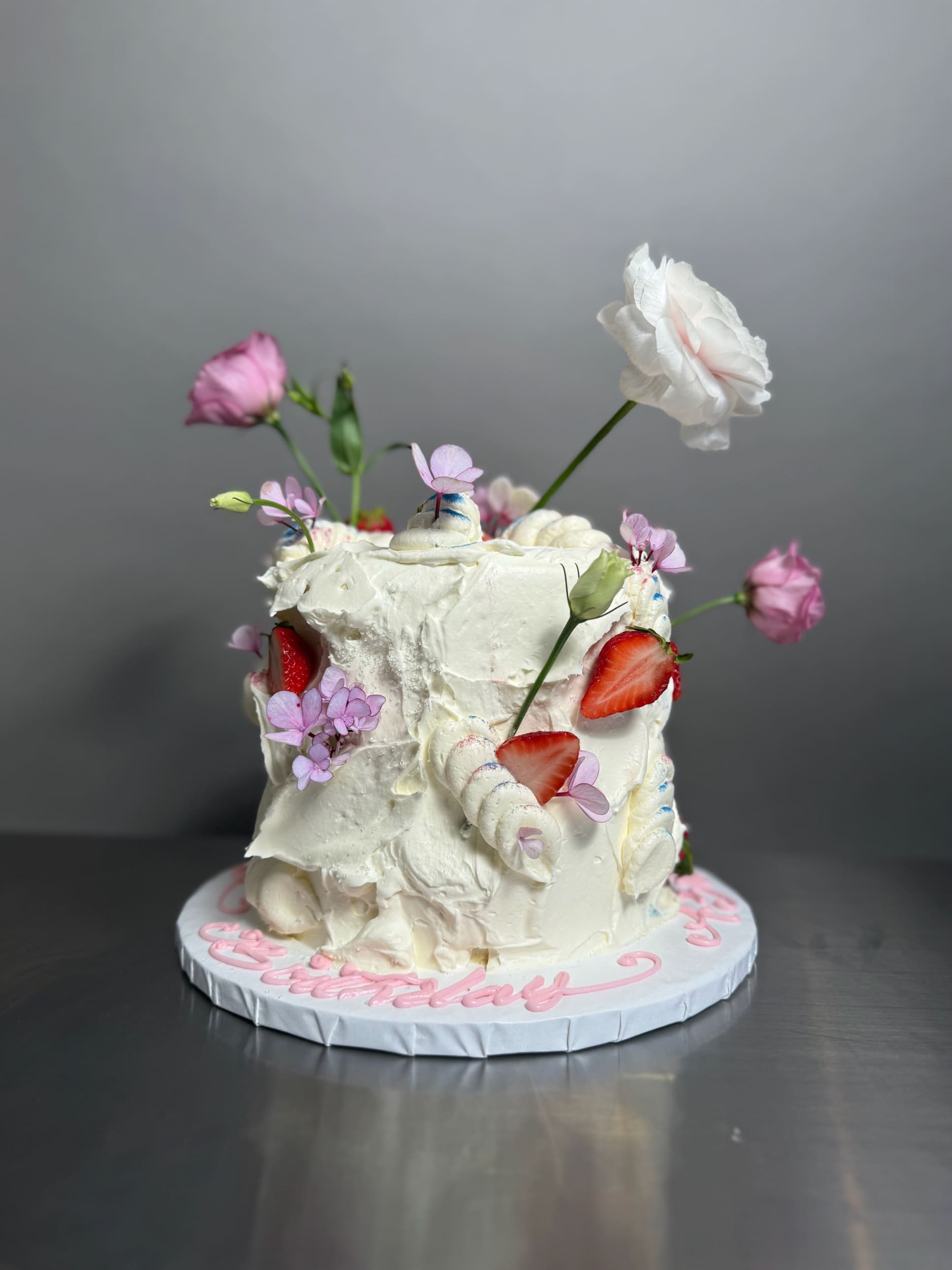 Wild fresh flowers &amp; strawberries on buttercream - custom cake