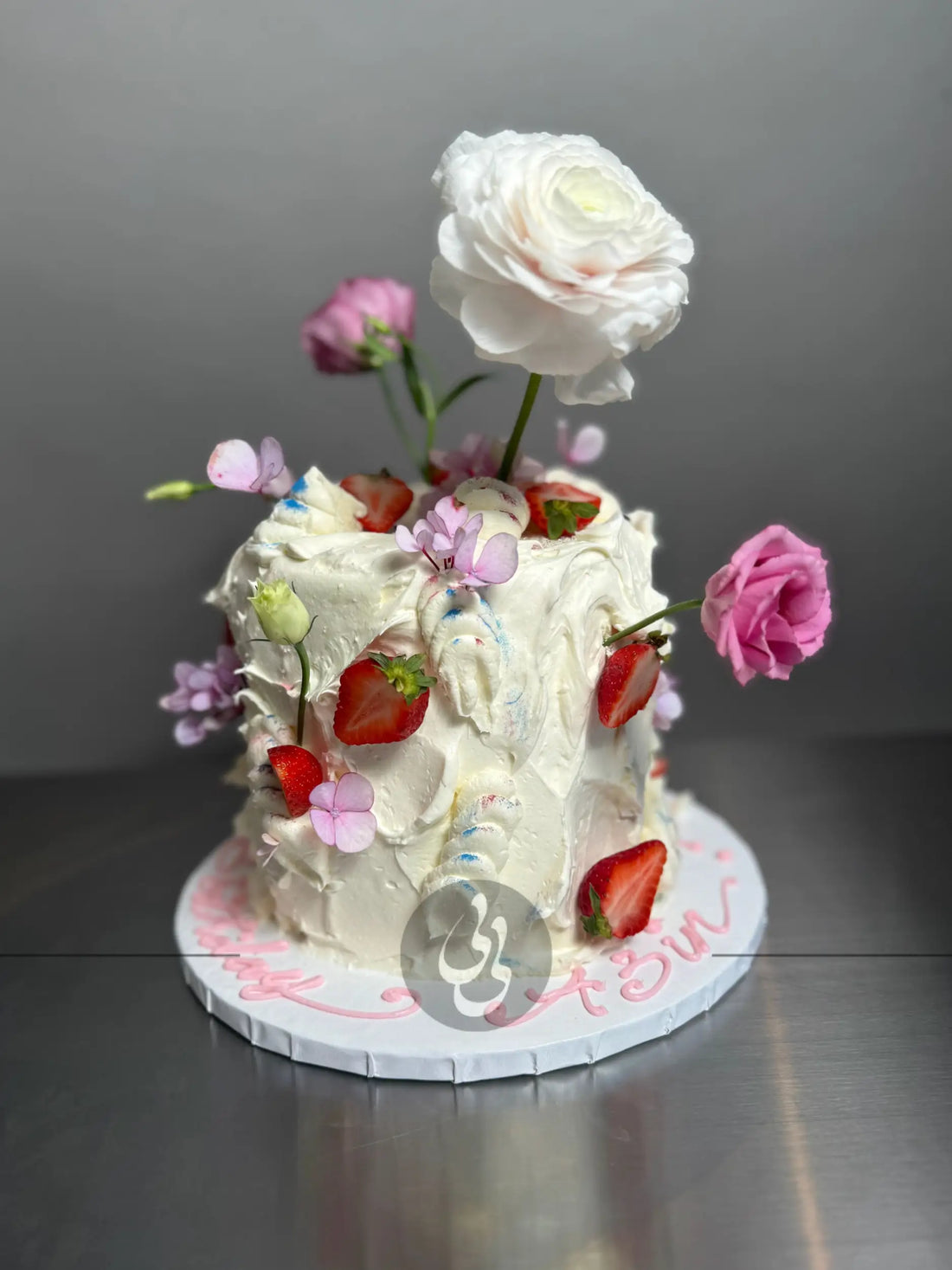 Wild fresh flowers &amp; strawberries on buttercream - custom cake